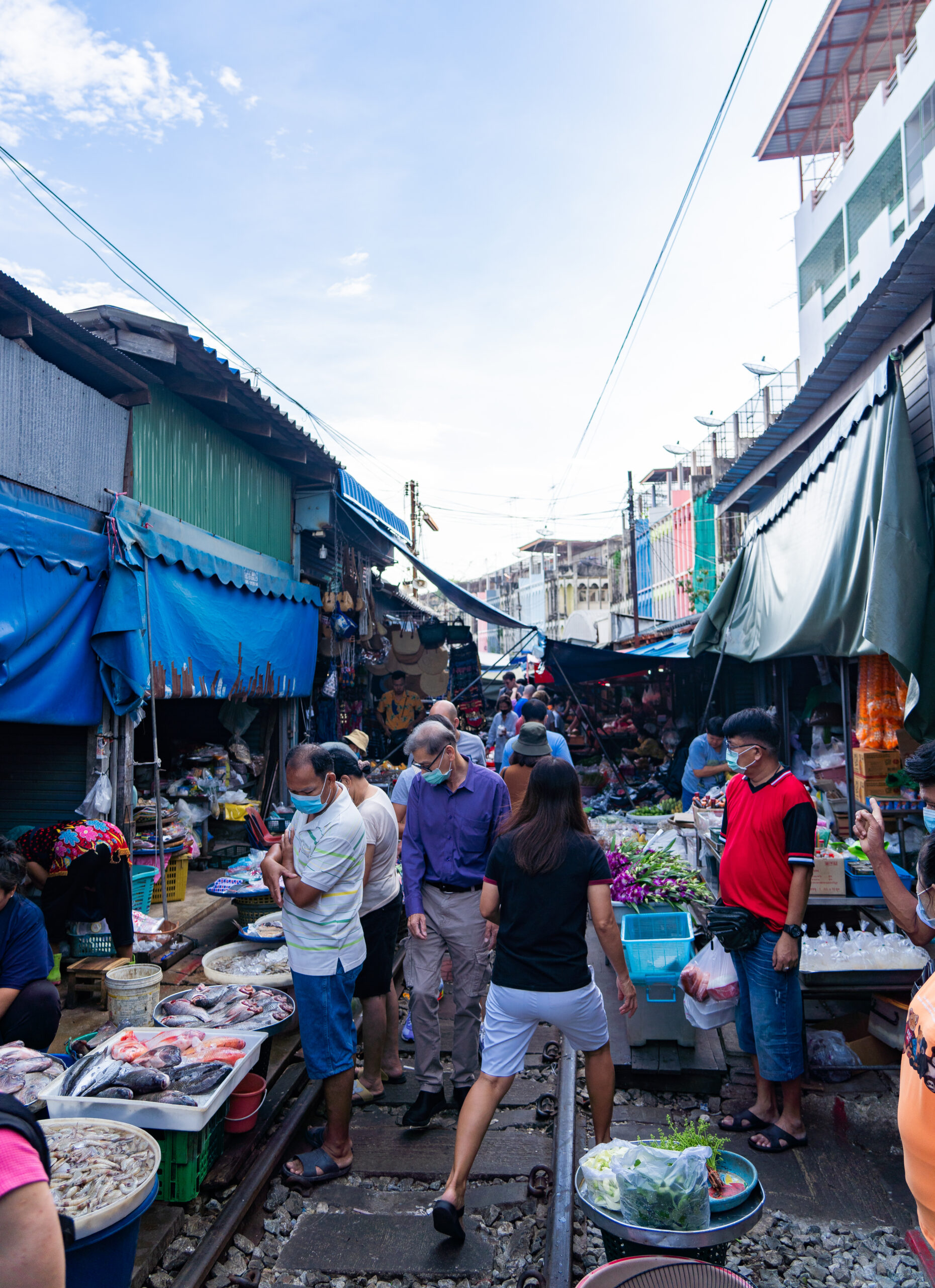 Crowded tracks while visiting the Maeklong Railway Market -